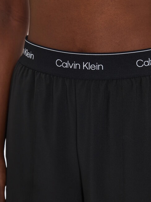 CK PERFORMANCE Palazzo trousers with logo elastic black beauty - Sports suits for women