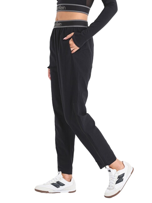 CK PERFORMANCE Tracksuit bottoms with zips black beauty - Sports suits for women